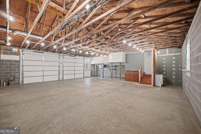 garage with concrete block wall