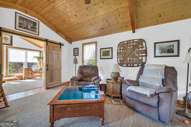 181 Yonah Lake Cir, Toccoa, GA 30577 - living area with a barn door, healthy amount of natural light, lofted ceiling, wooden ceiling, and wood finished floors