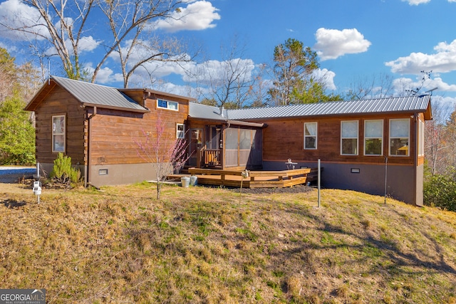 181 Yonah Lake Cir, Toccoa, GA 30577 - rear view of property featuring crawl space, a wooden deck, metal roof, a lawn, and a sunroom