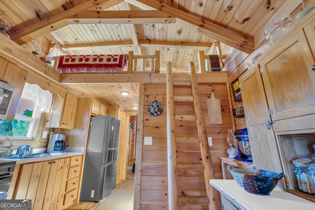 181 Yonah Lake Cir, Toccoa, GA 30577 - kitchen featuring freestanding refrigerator, light countertops, wood ceiling, a sink, and light brown cabinetry