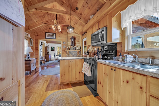 181 Yonah Lake Cir, Toccoa, GA 30577 - kitchen with black range with electric cooktop, stainless steel microwave, light brown cabinetry, a peninsula, and wooden walls