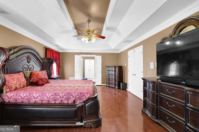 1621 Telfair Chase Way, Lawrenceville, GA 30043 - bedroom featuring a tray ceiling, crown molding, dark wood finished floors, and visible vents