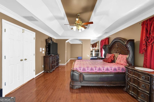 1621 Telfair Chase Way, Lawrenceville, GA 30043 - bedroom with baseboards, ornamental molding, visible vents, a raised ceiling, and wood finished floors