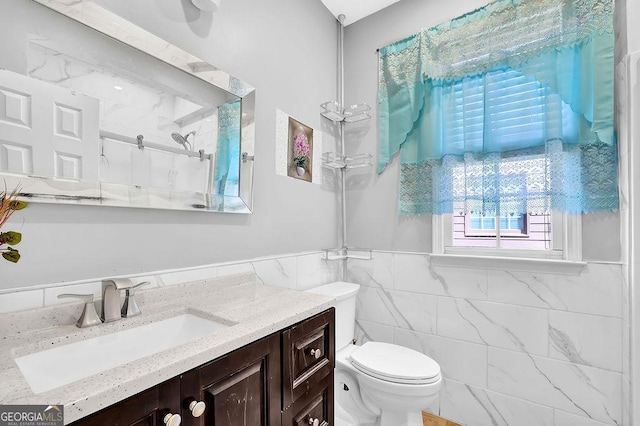 1621 Telfair Chase Way, Lawrenceville, GA 30043 - full bathroom featuring vanity, a wainscoted wall, toilet, a shower, and tile walls