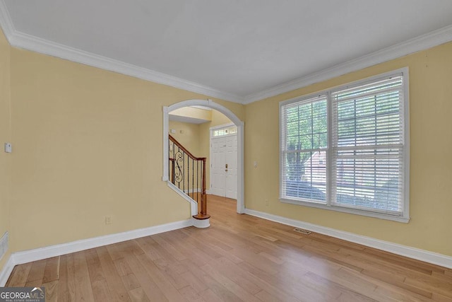 1621 Telfair Chase Way, Lawrenceville, GA 30043 - unfurnished room featuring arched walkways, wood finished floors, baseboards, and ornamental molding