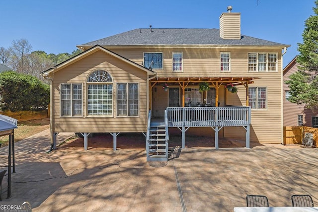 1621 Telfair Chase Way, Lawrenceville, GA 30043 - back of property featuring a deck and a chimney