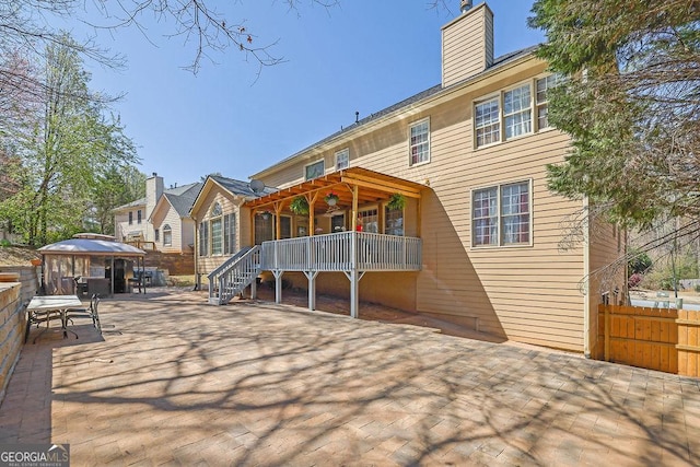 1621 Telfair Chase Way, Lawrenceville, GA 30043 - back of house with a patio, a gazebo, fence, and a chimney