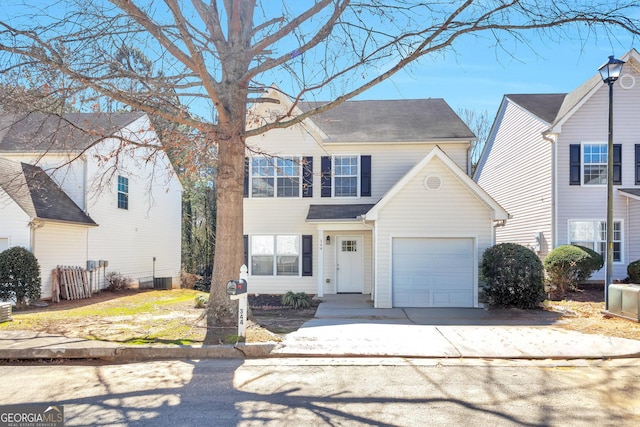 344 Springbottom Ct, Lawrenceville, GA 30046 - view of front of property with a garage, concrete driveway, central AC unit, and roof with shingles