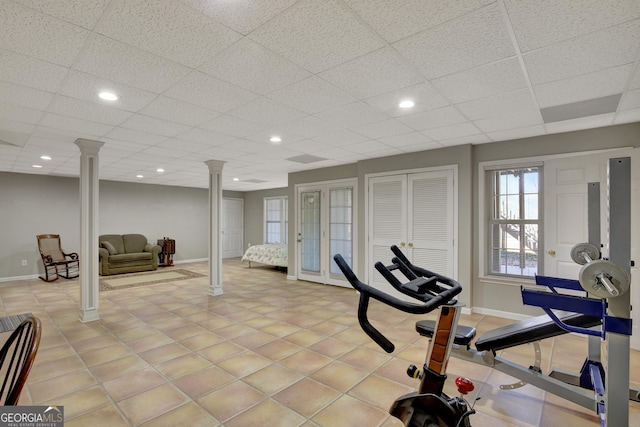 exercise area with recessed lighting, baseboards, and decorative columns