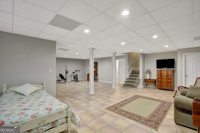 bedroom with recessed lighting, light tile patterned flooring, and ornate columns