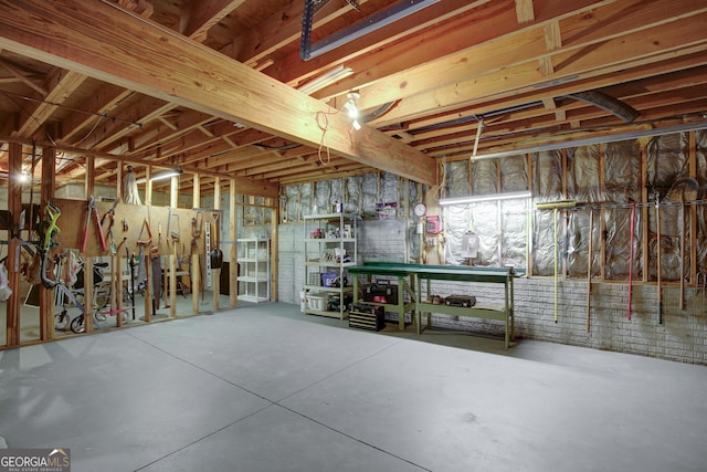 unfinished basement with a workshop area