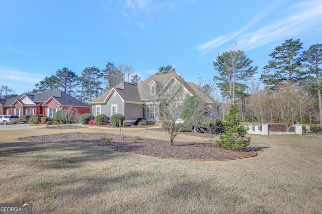 view of front of property with a front lawn