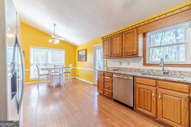 45 Somerset Ct, Covington, GA 30016 - living room featuring stairs, high vaulted ceiling, a ceiling fan, light wood-type flooring, and baseboards