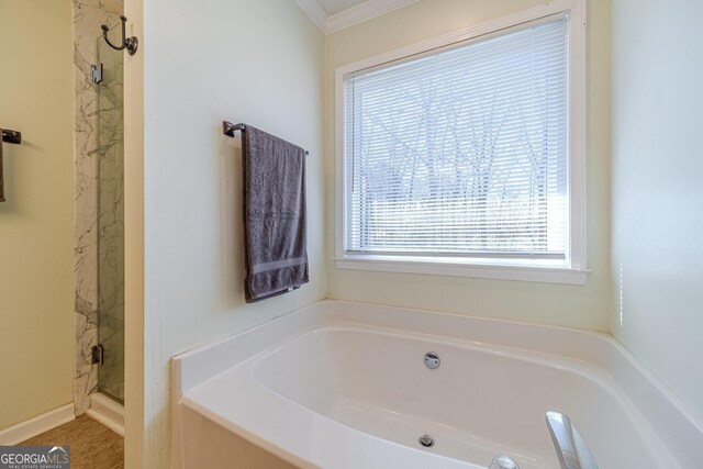 45 Somerset Ct, Covington, GA 30016 - bathroom with ornamental molding, a stall shower, and a garden tub