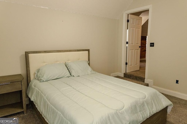 430 Brantley Rdg, Warner Robins, GA 31088 - bedroom featuring dark carpet and lofted ceiling