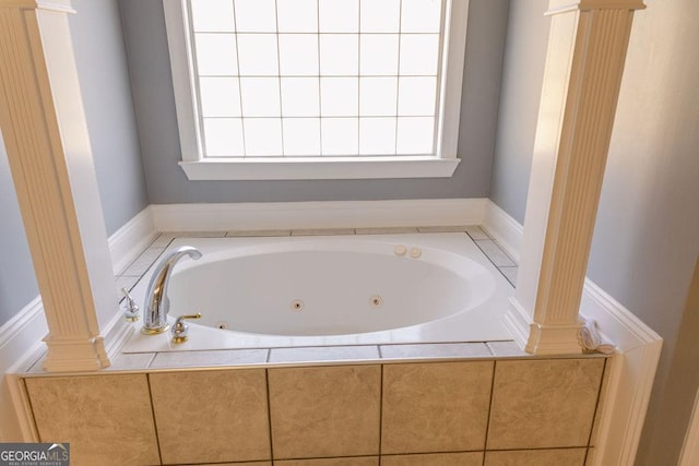 430 Brantley Rdg, Warner Robins, GA 31088 - bathroom with ornate columns, a whirlpool tub, and healthy amount of natural light