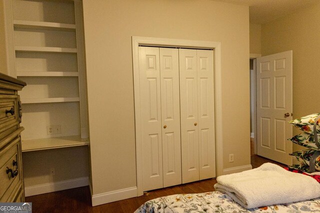 430 Brantley Rdg, Warner Robins, GA 31088 - bedroom featuring a closet and dark wood-style flooring