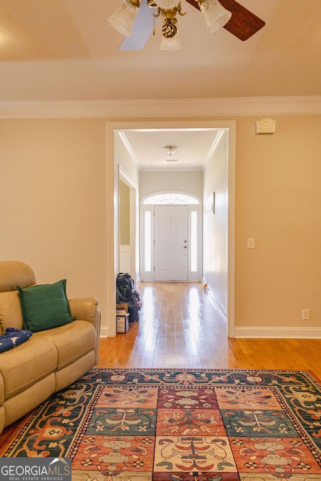 430 Brantley Rdg, Warner Robins, GA 31088 - entryway with ornamental molding, wood finished floors, and ceiling fan