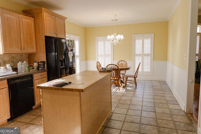 430 Brantley Rdg, Warner Robins, GA 31088 - kitchen with black appliances, butcher block counters, a wainscoted wall, a chandelier, and ornamental molding