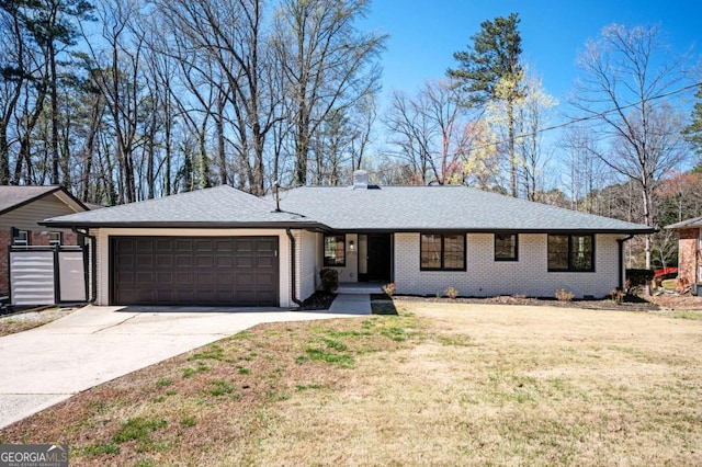 ranch-style house with a garage, driveway, brick siding, and a front lawn