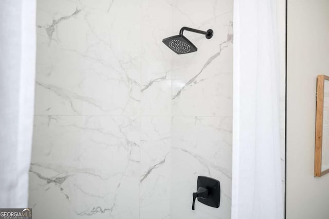 room details with a marble finish shower