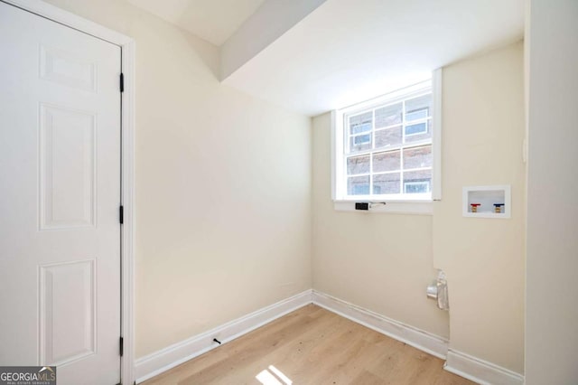 laundry room with laundry area, light wood-style flooring, baseboards, and washer hookup