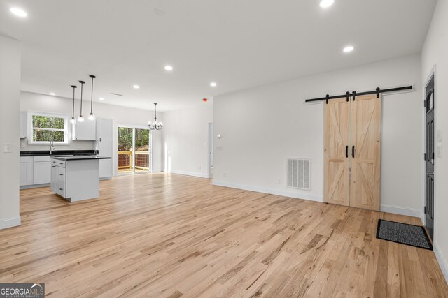 164 Colorado Ln, Clayton, GA 30525 - spare room with a healthy amount of sunlight, light wood-style flooring, and visible vents