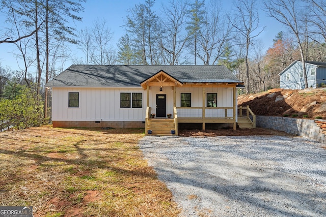 164 Colorado Ln, Clayton, GA 30525 - view of front of home with covered porch, driveway, a shingled roof, and board and batten siding