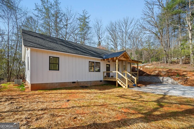 164 Colorado Ln, Clayton, GA 30525 - view of front of property featuring a shingled roof, cooling unit, and crawl space