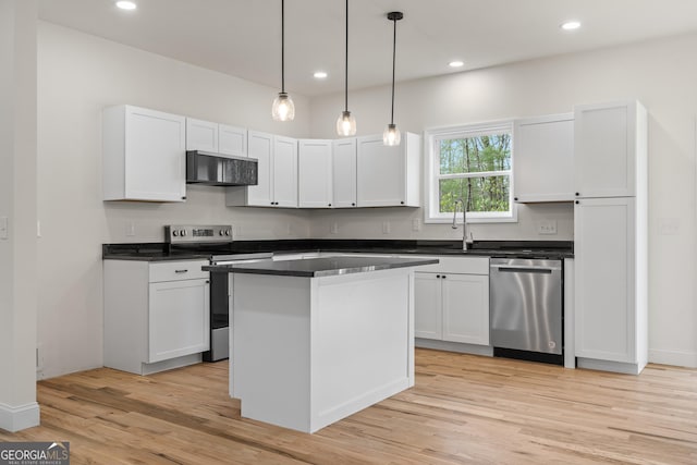 164 Colorado Ln, Clayton, GA 30525 - kitchen with a sink, stainless steel appliances, light wood-style flooring, white cabinets, and hanging light fixtures