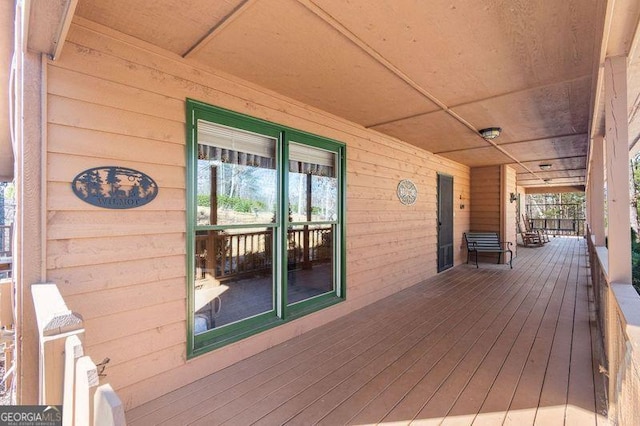 wooden terrace with covered porch
