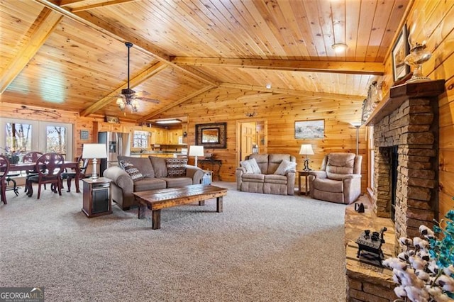 living room with carpet flooring, wooden ceiling, and wooden walls