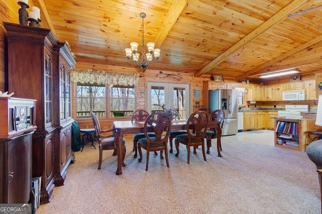 dining room with wood ceiling, light carpet, and a notable chandelier