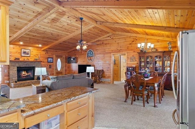 kitchen featuring freestanding refrigerator, wooden walls, wood ceiling, and light colored carpet