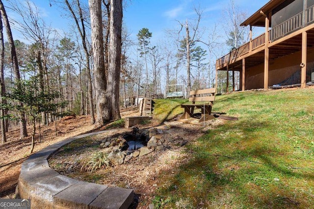 view of yard featuring a wooden deck