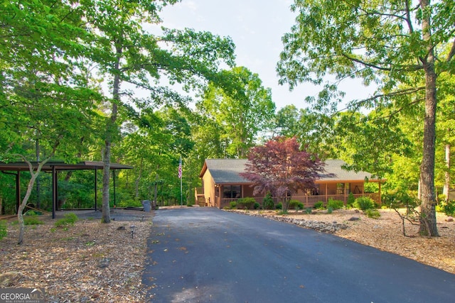 view of front of property with a porch and aphalt driveway