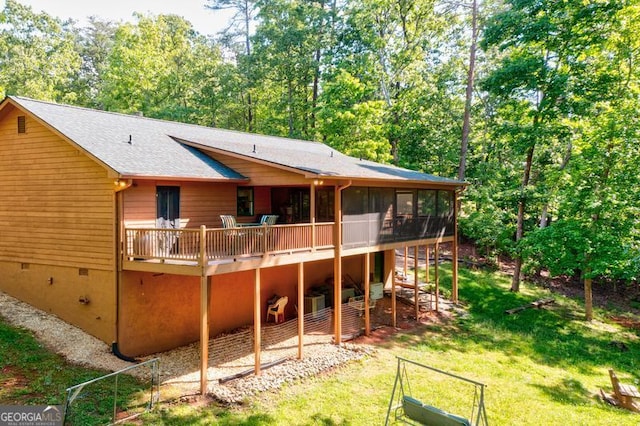105 Oak View Trl, Cleveland, GA 30528 - back of property featuring a wooden deck, roof with shingles, a yard, a sunroom, and crawl space