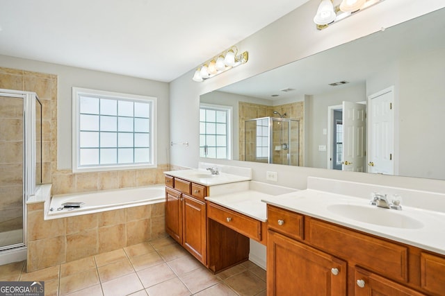 2848 Stockbridge Way, Dacula, GA 30019 - bathroom featuring double vanity, a shower stall, tile patterned floors, and a garden tub