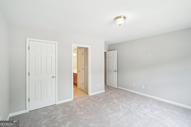 2848 Stockbridge Way, Dacula, GA 30019 - unfurnished bedroom featuring light carpet, baseboards, and ensuite bath