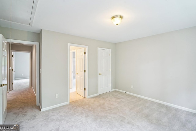 2848 Stockbridge Way, Dacula, GA 30019 - unfurnished bedroom with attic access, light carpet, baseboards, and ensuite bath