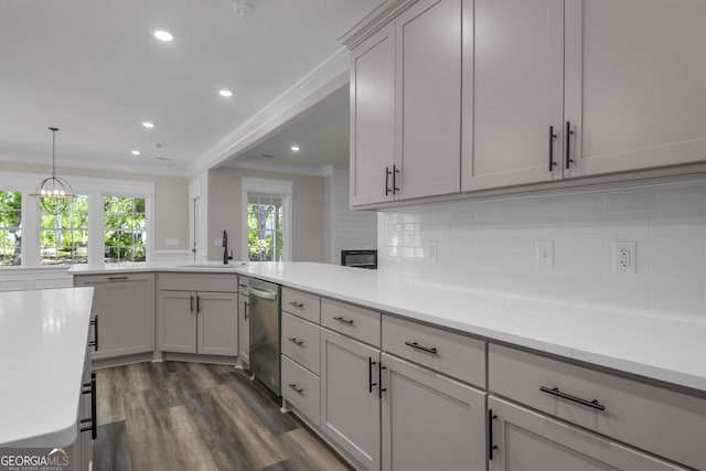 243 Barrington Oaks Dr, Brunswick, GA 31523 - kitchen with recessed lighting, dark wood-style floors, a sink, crown molding, and tasteful backsplash