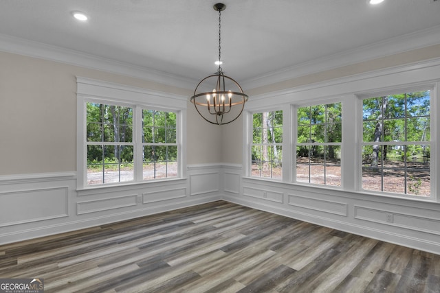 243 Barrington Oaks Dr, Brunswick, GA 31523 - unfurnished dining area featuring wainscoting, an inviting chandelier, and crown molding