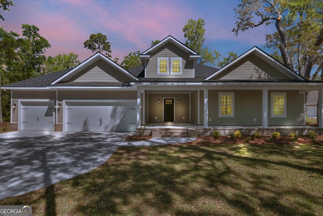243 Barrington Oaks Dr, Brunswick, GA 31523 - view of front of property with concrete driveway, an attached garage, a yard, and covered porch