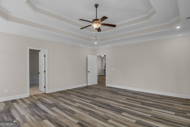 243 Barrington Oaks Dr, Brunswick, GA 31523 - empty room featuring wood finished floors, a tray ceiling, and a ceiling fan