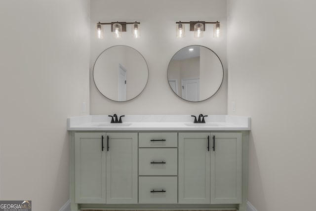 243 Barrington Oaks Dr, Brunswick, GA 31523 - bathroom featuring double vanity, baseboards, and a sink