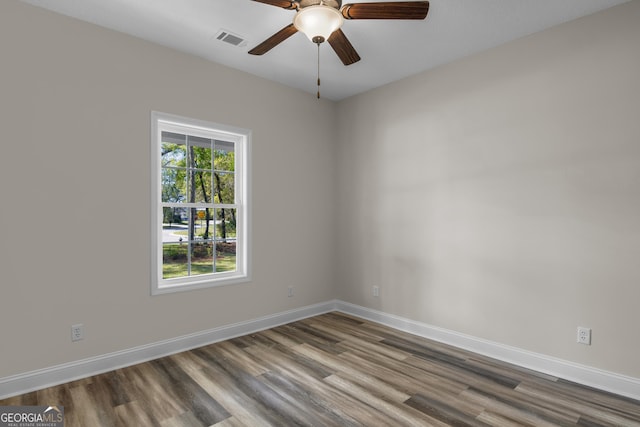 243 Barrington Oaks Dr, Brunswick, GA 31523 - spare room featuring baseboards, wood finished floors, and visible vents