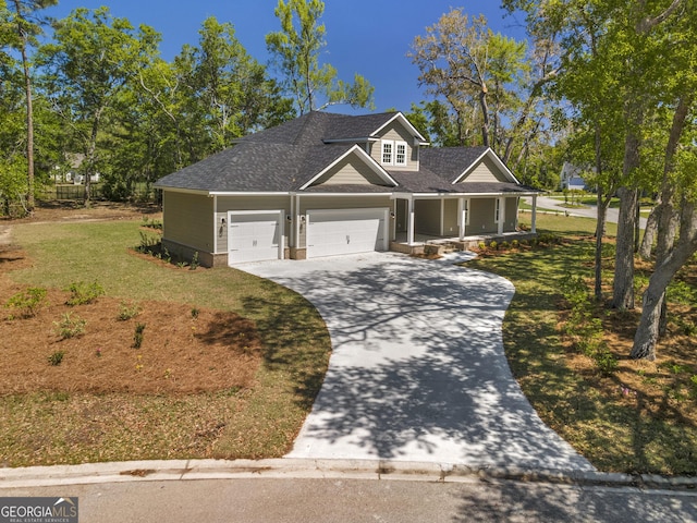 243 Barrington Oaks Dr, Brunswick, GA 31523 - craftsman-style house featuring a porch, an attached garage, a front lawn, and concrete driveway