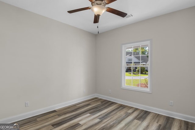 243 Barrington Oaks Dr, Brunswick, GA 31523 - empty room featuring visible vents, a ceiling fan, baseboards, and dark wood-style flooring