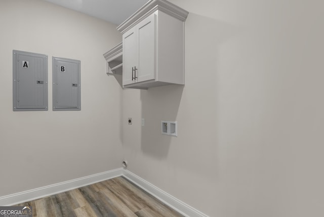 243 Barrington Oaks Dr, Brunswick, GA 31523 - washroom with hookup for an electric dryer, wood finished floors, electric panel, and baseboards