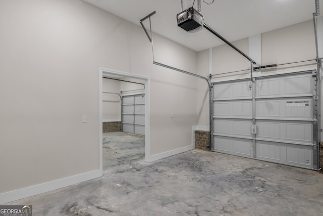 243 Barrington Oaks Dr, Brunswick, GA 31523 - garage featuring a garage door opener and baseboards